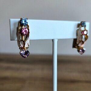 Vintage Austrian clip on earrings with blue pink and purple rhinestones.